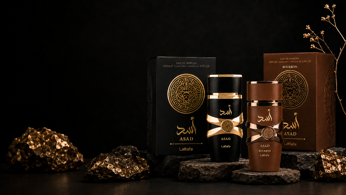 Lattafa Asad perfumes displayed on dark rocks with gold accents
